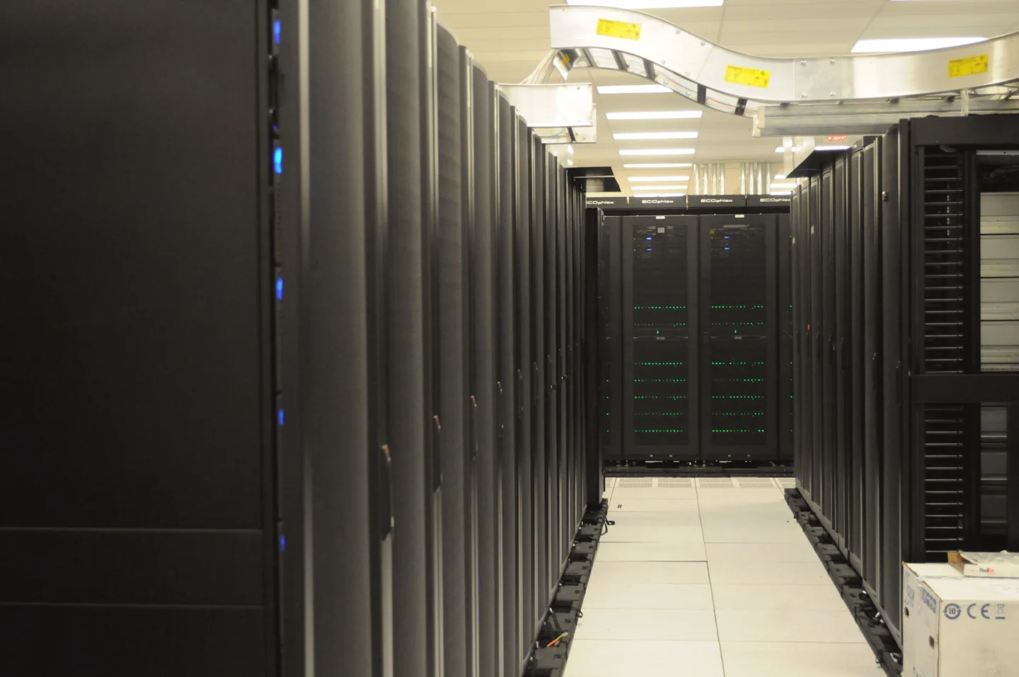 Rows of server equipment and network cables at NERSC