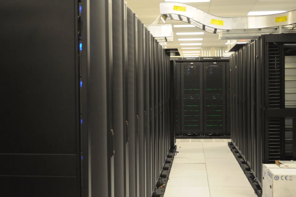 Rows of server equipment and network cables at NERSC